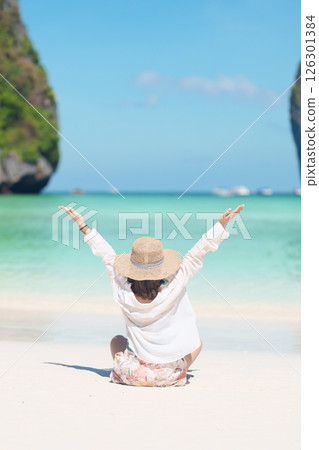 Woman tourist traveling and sightseeing in Krabi, Thailand, happy traveller enjoy at Maya Bay beach on Phi Phi island, Popular paradise island, destination, Southeast Asia Travel, vacation and holiday Woman tourist traveling and sightseeing in Krabi, Thailand, happy traveller enjoy at Maya Bay beach on Phi Phi island, Popular paradise island, destination, Southeast Asia Travel, vacation and holiday 126301384