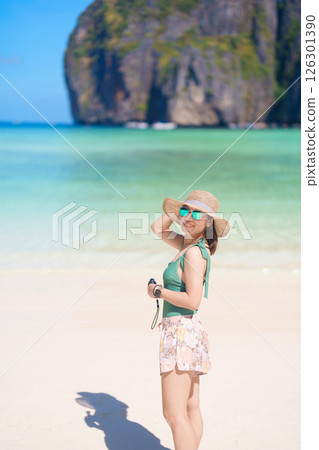 Woman tourist traveling and sightseeing in Krabi, Thailand, happy traveller enjoy at Maya Bay beach on Phi Phi island, Popular paradise island, destination, Southeast Asia Travel, vacation and holiday 126301390