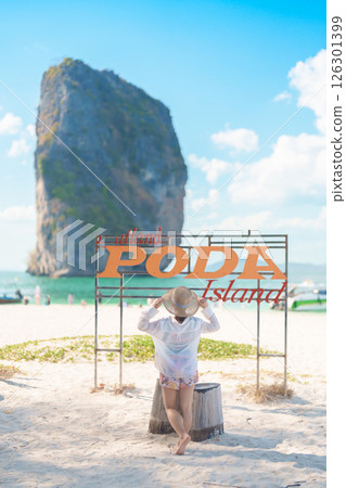 Woman tourist traveling and sightseeing in Krabi, Thailand. happy traveller enjoy on beach at Koh Poda island. summer trip, destination, Southeast Asia Travel, vacation and holiday concept Woman tourist traveling and sightseeing in Krabi, Thailand. happy traveller enjoy on beach at Koh Poda island. summer trip, destination, Southeast Asia Travel, vacation and holiday concept 126301399