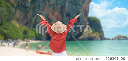 Woman tourist travel and sightseeing in Krabi, Thailand. happy traveller enjoy on beach at Phra nang Cave Beach near Railay Beach. summer trip, destination, Southeast Asia Travel and vacation concept Woman tourist travel and sightseeing in Krabi, Thailand. happy traveller enjoy on beach at Phra nang Cave Beach near Railay Beach. summer trip, destination, Southeast Asia Travel and vacation concept 126301408