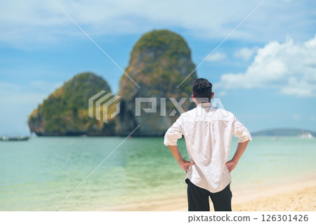 man tourist travel and sightseeing in Krabi, Thailand. happy traveller enjoy on beach at Phra nang Cave Beach near Railay Beach. summer trip, destination, Southeast Asia Travel and vacation concept 126301426