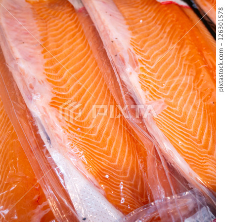 Salmon fillet in a vacuum package plastic bag. 126301578