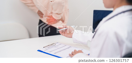 Elderly woman having back body ache and consulting doctor in hospital. Senior female with muscle pain due to Piriformis Syndrome, Low Back Pain and Spinal Compression. Office syndrome and medical Elderly woman having back body ache and consulting doctor in hospital. Senior female with muscle pain due to Piriformis Syndrome, Low Back Pain and Spinal Compression. Office syndrome and medical 126301757