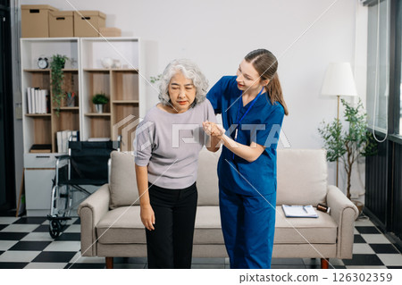 Female hands touching senior male hand Helping hands take care of the elderly concept in hospital Female hands touching senior male hand Helping hands take care of the elderly concept in hospital 126302359