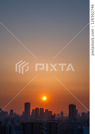 Sunrise seen from a building around Osaka Bentencho Station (photographed in May) 126302746