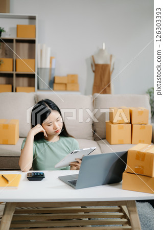 Small business entrepreneur SME freelance woman working at home office, BOX,tablet and laptop online, marketing, packaging, delivery 126303393