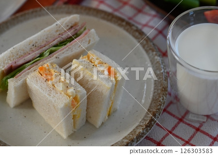 Delicious looking sandwiches, egg and ham sandwiches Delicious looking sandwiches, egg and ham sandwiches 126303583