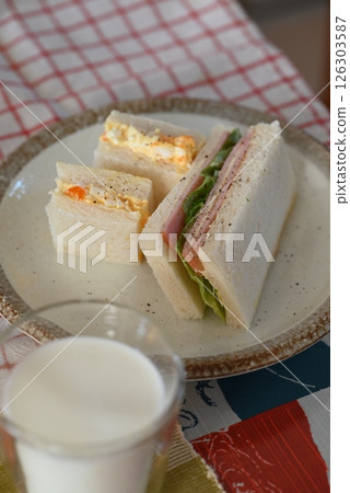 Delicious looking sandwiches, egg and ham sandwiches Delicious looking sandwiches, egg and ham sandwiches 126303587