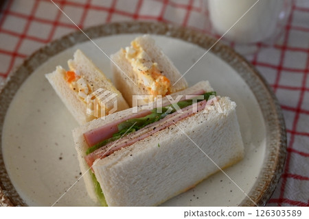 Delicious looking sandwiches, egg and ham sandwiches Delicious looking sandwiches, egg and ham sandwiches 126303589