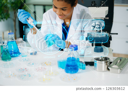 Young scientists conducting research investigations in a medical laboratory, a researcher in the foreground 126303612