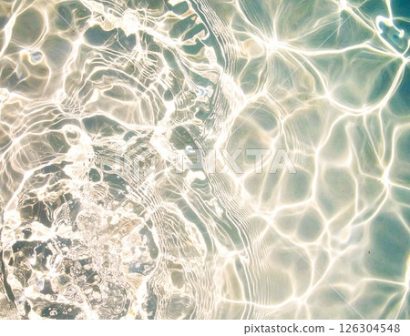 Ripples spreading across the transparent water surface Ripples spreading across the transparent water surface 126304548
