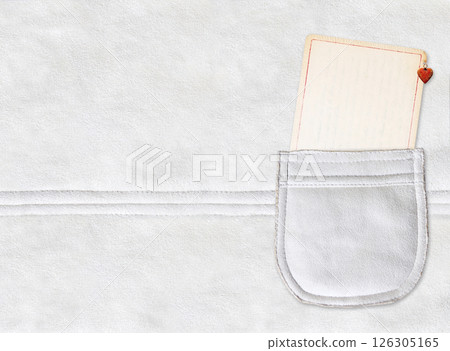 Horizontal backdrop with paper tag in suede pocket. Eco-friendly paper label in suede leather pocket of ivory color. Sustainable development of strategy approach to zero waste, responsible consumption 126305165