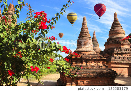Balloon flight, famous tourist attraction of Bagan, Myanmar. Air balloons and ancient stupas in archaeological zone, Bagan, Burma. Topic of vacation, travel, trip abroad on vacation, cruises and tours 126305179