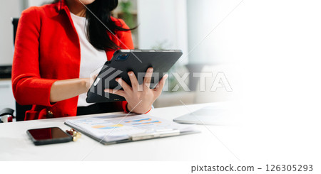 Businesswoman utilizing smartphone and tablet technology. Perfect for corporate, technology Businesswoman utilizing smartphone and tablet technology. Perfect for corporate, technology 126305293