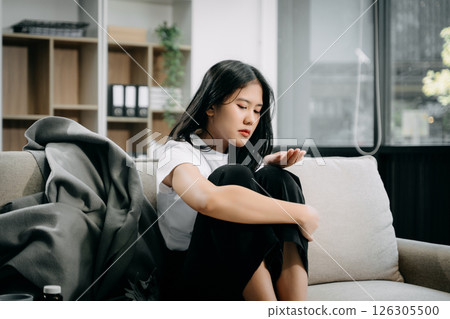 woman sit Depression Dark haired  pensive glance Standing by window and anxiety Copy space. 126305500