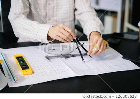 Close up of business people having consultation about wind energy at company office. on architectural project site 126305628