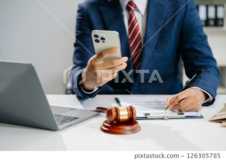 Justice and law concept.Male judge in a courtroom on white table and Counselor or Male lawyer working in office. 126305785