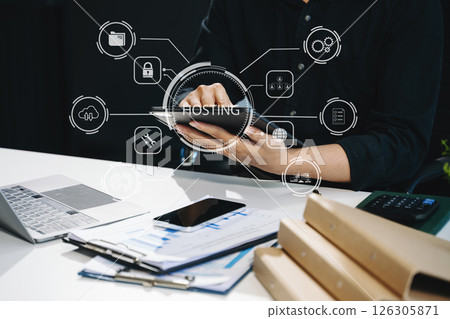 Web hosting concept, woman using computer, tablet and presses his finger on the virtual screen inscription Hosting 126305871