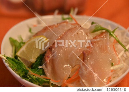A luxurious salad topped with red snapper sashimi A luxurious salad topped with red snapper sashimi 126306848