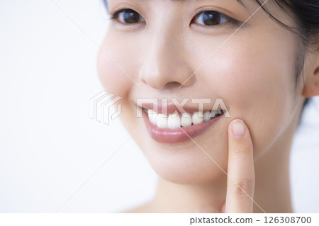 Beauty Oral Care A woman's mouth holding a toothbrush 126308700