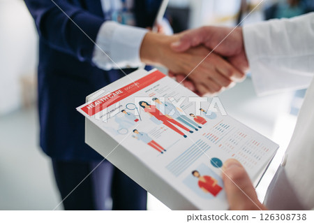 Medical sales representative introducing herself to doctor. 126308738