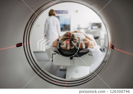 CT scanner view of patient during medical imaging procedure. 126308746