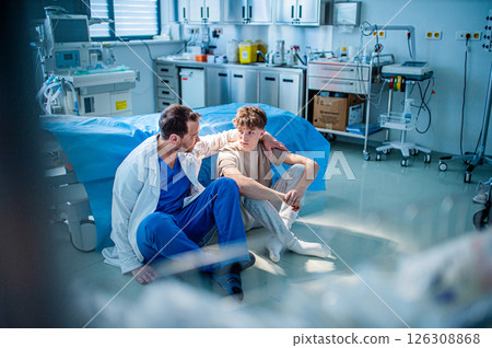 Teenager confiding in doctor about personal and health problems. 126308868