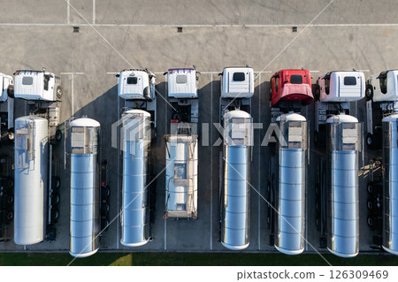Fleet of trucks with tank trailers. 126309469