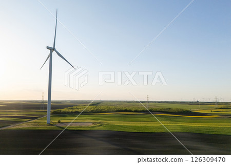 Aerial view of wind turbines on an agricultural field. Sustainable energy 126309470