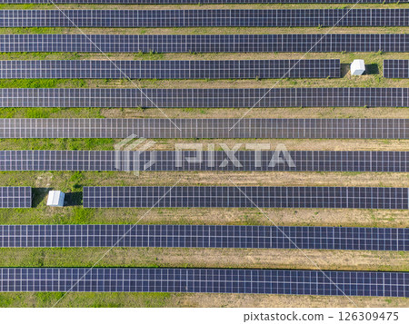 Aerial view of solar power station and green agricultural field. Sustainable development Aerial view of solar power station and green agricultural field. Sustainable development 126309475