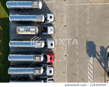 Fleet of trucks with tank trailers. 126309495