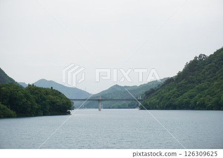 The blue Agatsuma River and bridge seen from "Maruiwa Station on Lake Yatsuba" 126309625