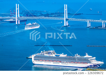 Yokohama cityscape in Japan. Three luxury cruise ships. Riviera leaving port. Diamond also leaving port (foreground)…Queen in the background left… 126309672