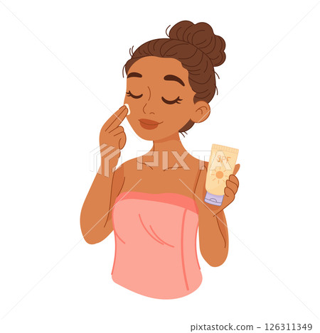 Dark-skinned woman applying SPF sunscreen to her face 126311349
