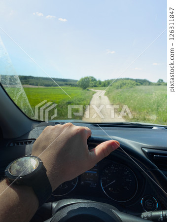 Driving on a Scenic Rural Dirt Road Driving on a Scenic Rural Dirt Road 126311847