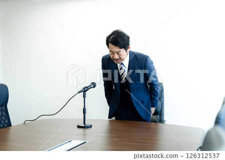 A businessman who apologizes 126312537