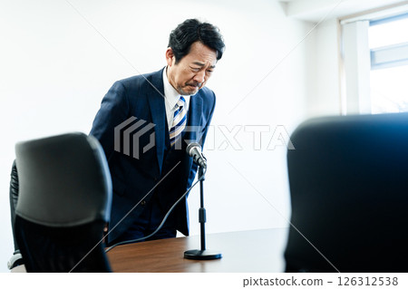 A businessman who apologizes A businessman who apologizes 126312538