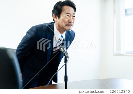 A businessman who apologizes A businessman who apologizes 126312540