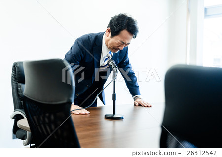 A businessman who apologizes A businessman who apologizes 126312542