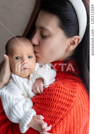Tender Moment Between Mother and Baby by the Window Tender Moment Between Mother and Baby by the Window 126312884