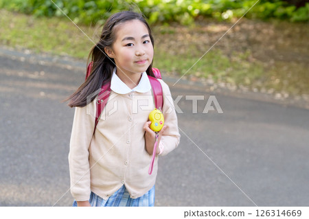 Elementary school girl with a security alarm 126314669
