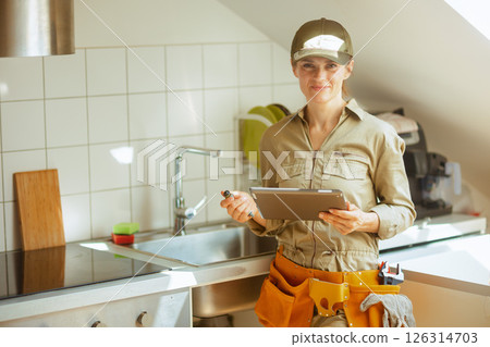 Young Plumber with Tablet Smiling Young Plumber with Tablet Smiling 126314703