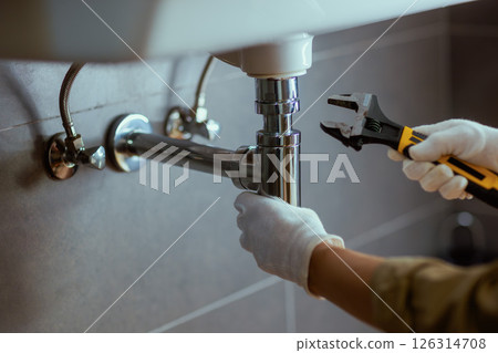 Plumber Fixing Sink Drain Plumber Fixing Sink Drain 126314708