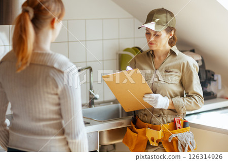 Plumber Discussing Sink Repair 126314926