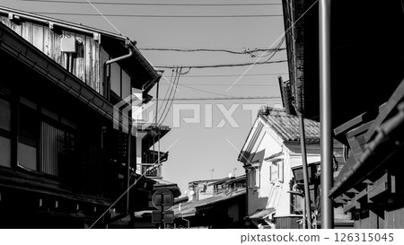 Monochrome street scene in Takayama historic Kamisannomachi district with visible power lines 126315045