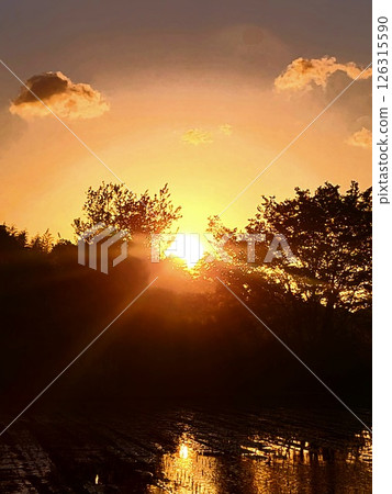 Sunset reflected in the countryside Sunset reflected in the countryside 126315590