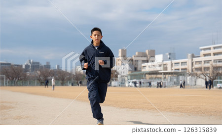 Male junior high school student running in the schoolyard 126315839