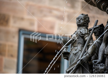 Nuremberg, Germany, August 2, 2023. On a rainy day detail of the fountain of virtues. Blurred background. Travel destinations 126316061
