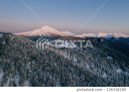 Winter aerial landscape of majestic Carpathian mountains. Background with sunset Winter aerial landscape of majestic Carpathian mountains. Background with sunset 126316180