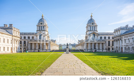 Historic collage buildings in Greenwich Campus showcase stunning architecture against a clear blue sky, inviting visitors to explore the rich history and beauty of this London location. Historic collage buildings in Greenwich Campus showcase stunning architecture against a clear blue sky, inviting visitors to explore the rich history and beauty of this London location. 126316833